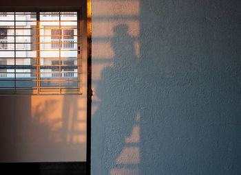 Reflection of building on glass window