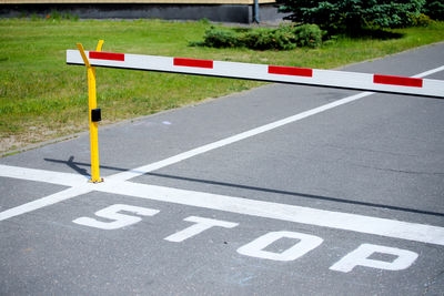 Arrow sign on road in city