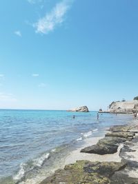 View of beach against blue sky