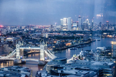 High angle view of illuminated bridge over river at night