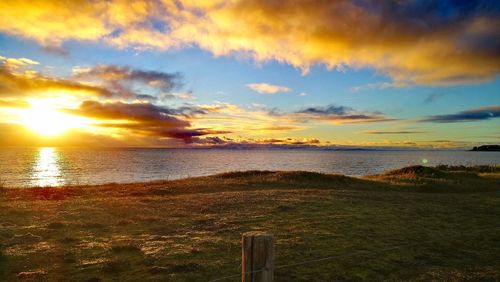 Scenic view of sea against sky during sunset