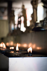 Illuminated light candles in building