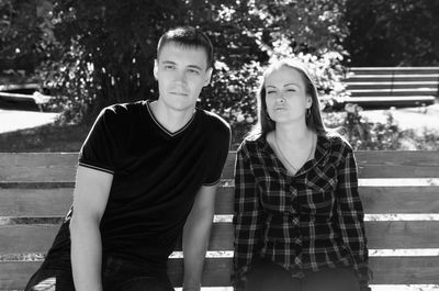 Portrait of a young couple sitting outdoors