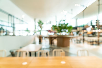 Empty chairs and tables in restaurant