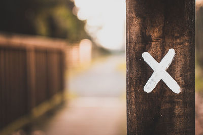 Close-up of text on wood