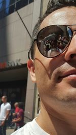 Cropped image of woman holding smart phone