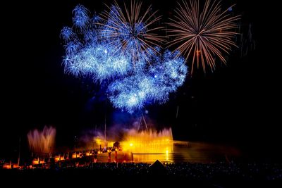 Firework display at night