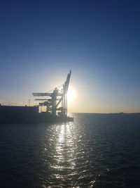 Scenic view of sea against clear sky during sunset