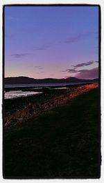 Scenic view of landscape against sky at sunset
