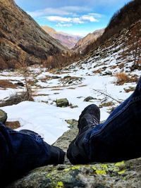 Low section of man against mountains during winter