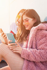 Young woman using mobile phone