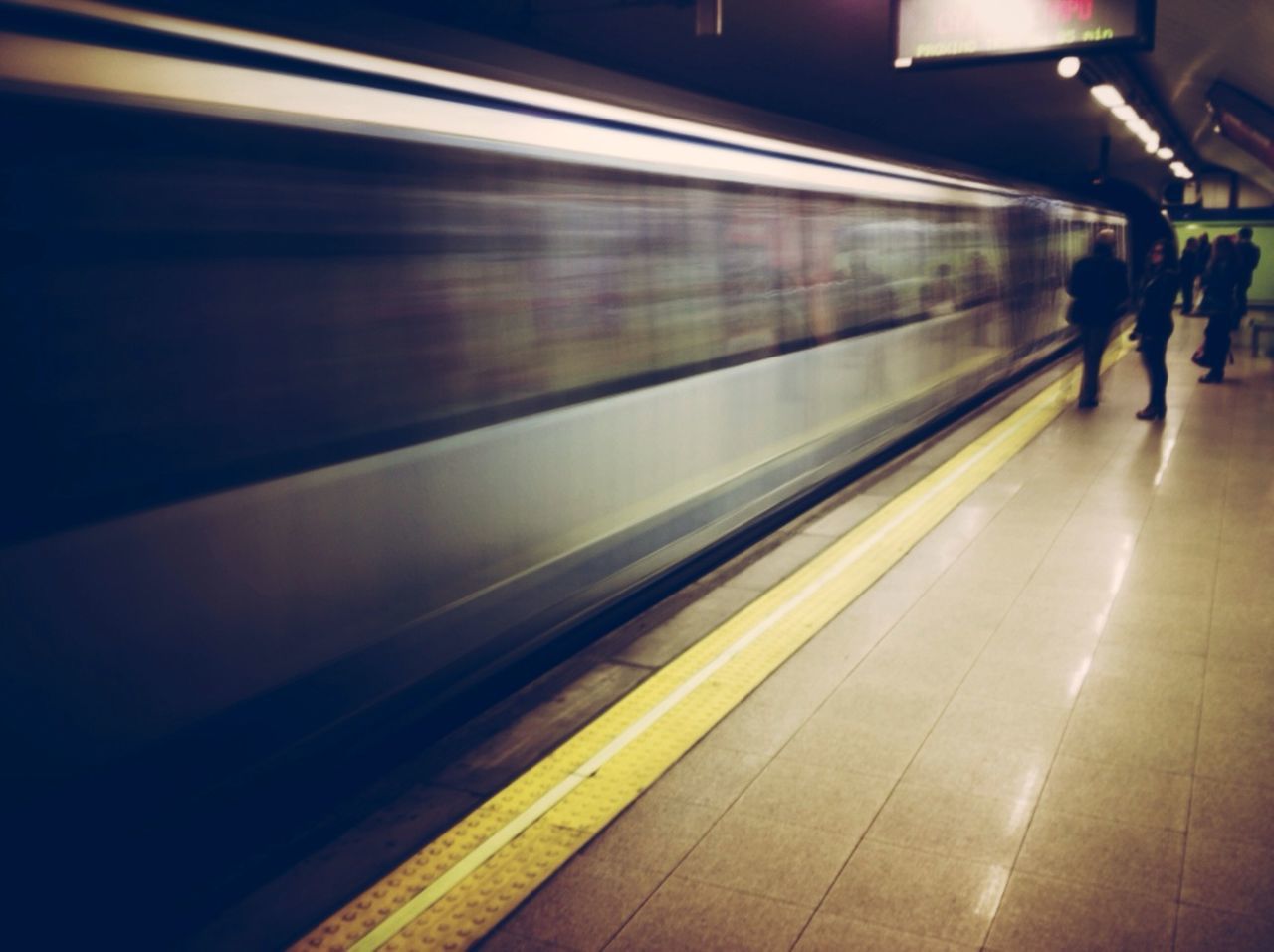 transportation, railroad station platform, public transportation, indoors, illuminated, railroad station, rail transportation, blurred motion, subway station, railroad track, motion, travel, speed, train - vehicle, mode of transport, men, subway, on the move, subway train