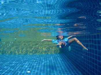 High angle view of man swimming in pool