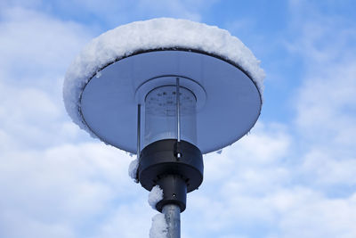 Low angle view of communications tower against sky