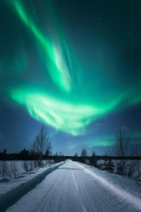 Road against sky at night