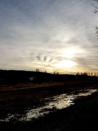 Scenic view of field against sky during sunset