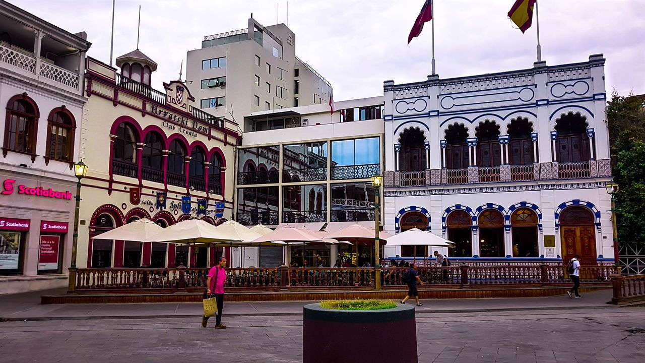 building exterior, architecture, built structure, city, group of people, men, real people, building, sky, street, women, people, nature, lifestyles, adult, day, city life, incidental people, transportation, travel, outdoors