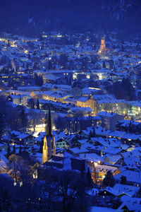 High angle view of illuminated buildings in city at night