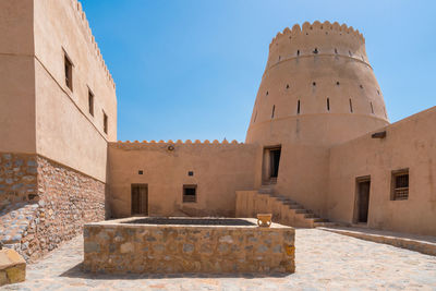 Courtyard of a small medieval arabian fort in bukha, oman.