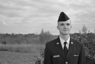 Portrait of mature man standing against the sky