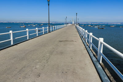 Pier over sea against sky