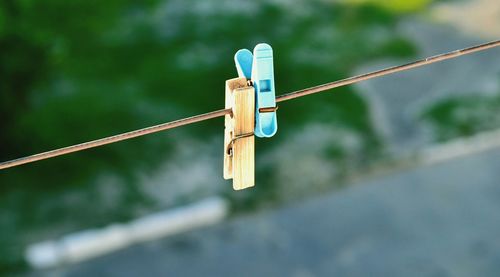 Close-up of clothespins on clothesline