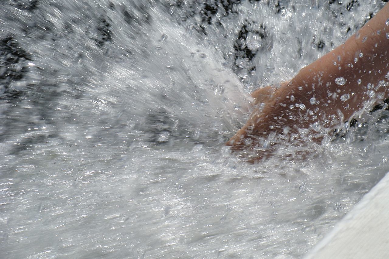 PERSON SPLASHING WATER