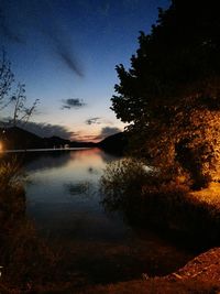 Scenic view of lake at sunset