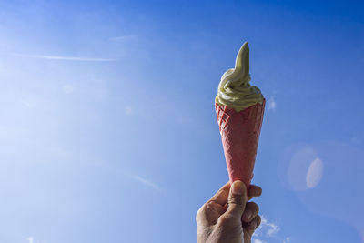 Human hand holding ice cream