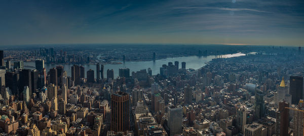 High angle view of modern buildings in city against sky