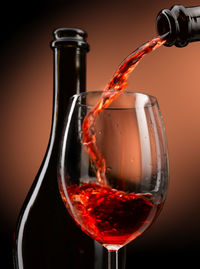 Close-up of wineglass on glass