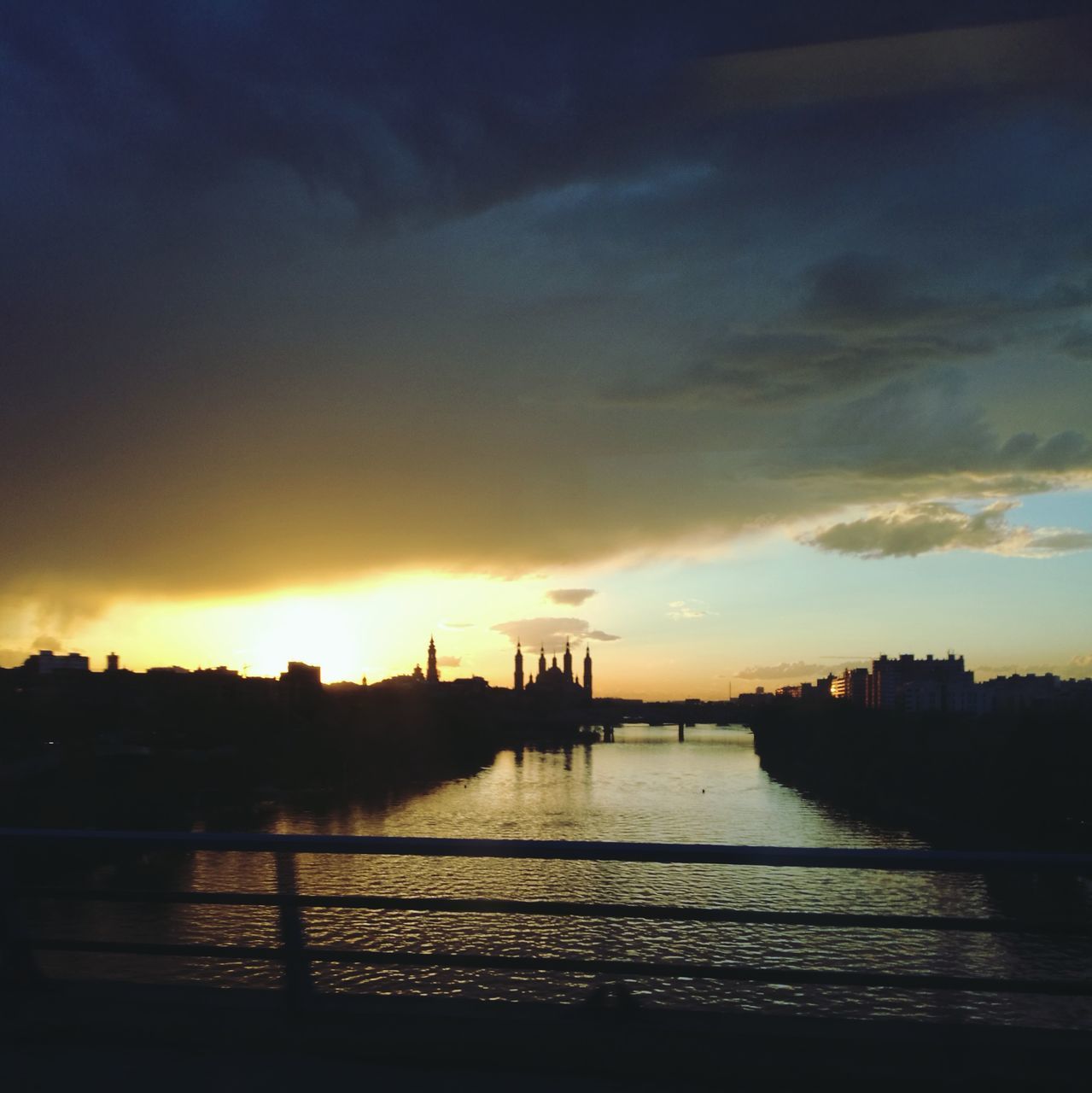 SILHOUETTE OF BUILDINGS AT SUNSET