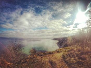 Scenic view of sea against cloudy sky