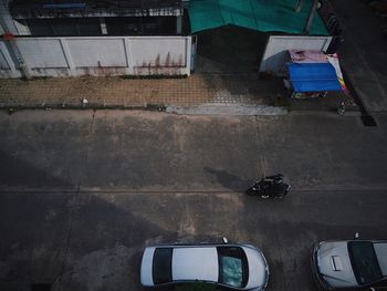 High angle view of person riding motorcycle on street