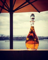 Close-up of water against sunset sky