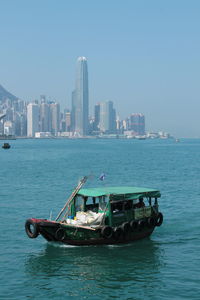 Chinese boat front of the buildings