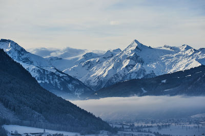 Scenic view of snowcapped mountains against sky