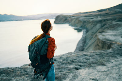 Man looking at sea against sky