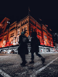 People on street at night