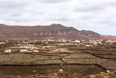 Aerial view of townscape against sky