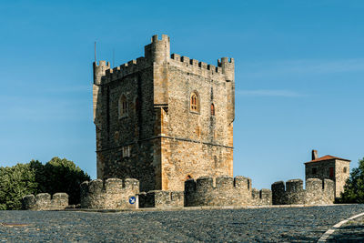 Low angle view of historical building against blue sky