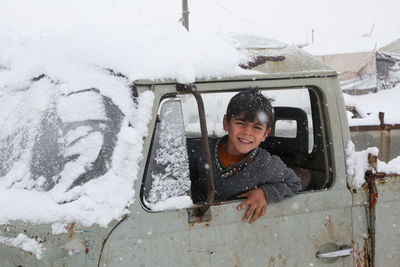 Syrian refugee children playing in the snow that fell on the camp near the syrian-turkish border.