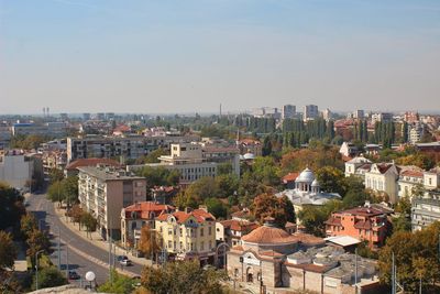 High angle shot of cityscape against clear sky