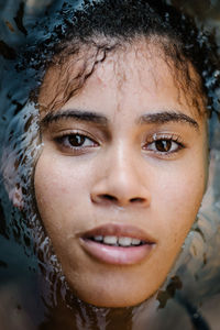 Close-up portrait of smiling young woman