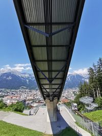 Low angle view of bridge and buildings against sky