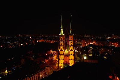 Illuminated buildings in city at night