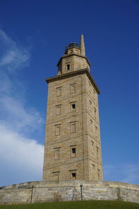 Low angle view of tower against blue sky