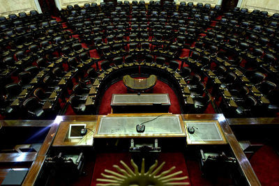 High angle view of empty chairs in building