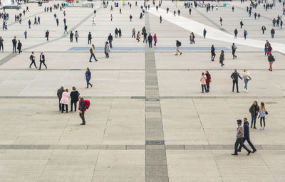 High angle view of people walking in city