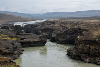 Scenic view of river and mountains